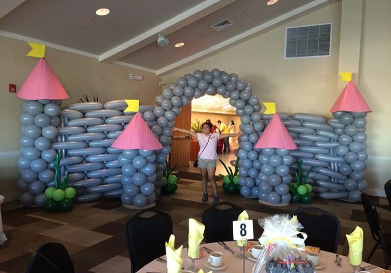 Balloon castle decoration at indoor party.